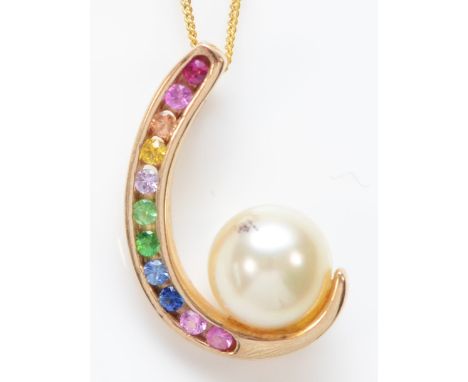 A 9ct gold multi colour ruby and sapphire and 6mm cultured pearl pendant, chain, 2gm 