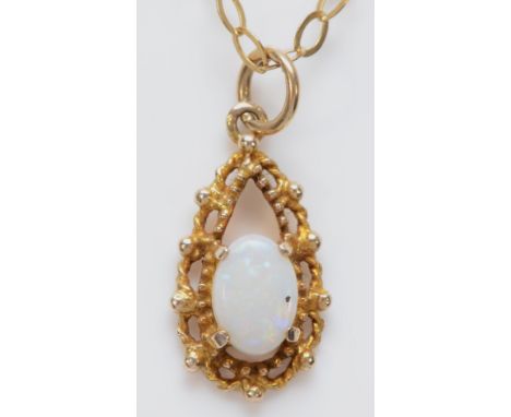 A 9ct gold opal mounted pendant, stone7mm, chain, 2.1gmThe black spot was a bit of dirt now removed