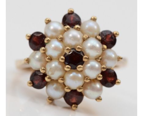 A 9ct gold garnet and seed pearl cluster ring, J, 3.9g 