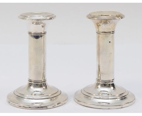 A silver pair of desk candlestick, Birmingham 1935, loaded, 11cm 