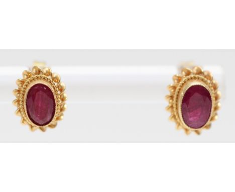A 9ct gold pair of ruby ear studs, 1.3gm 