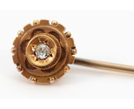 A 9ct gold and old cut diamond stick pin with a 7ct gold pin, 1.9g 