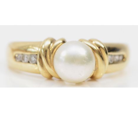 A 9ct gold and 7mm cultured pearl dress ring, brilliant cut diamond channel set shoulders, S, 3.6gm 