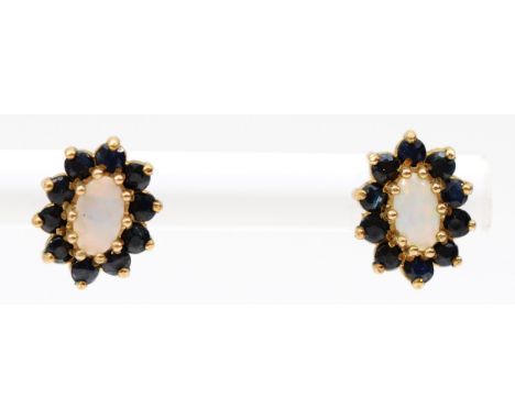 A 9ct gold pair of opal and sapphire ear studs, 1.1gm 