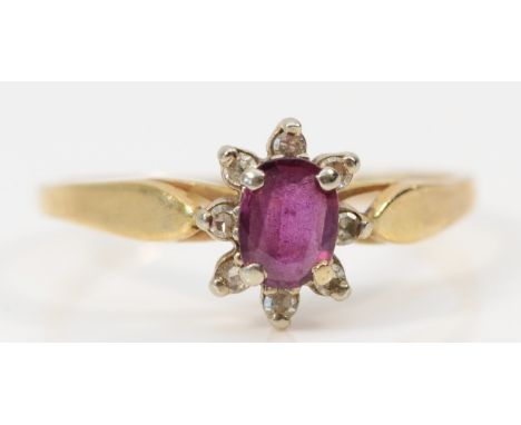 A 9ct gold ruby and diamond cluster ring, M, 1.3gm 