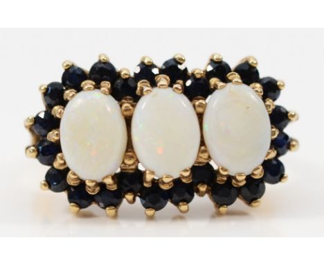 A 9ct gold three stone opal and sapphire cluster ring, K, 3.9gm 