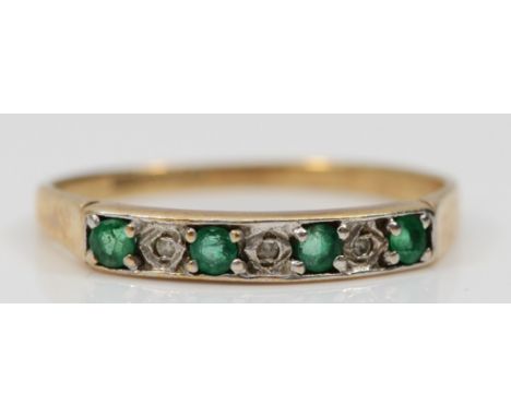 A 9ct gold emerald and diamond seven stone ring, O, 1.2gm 