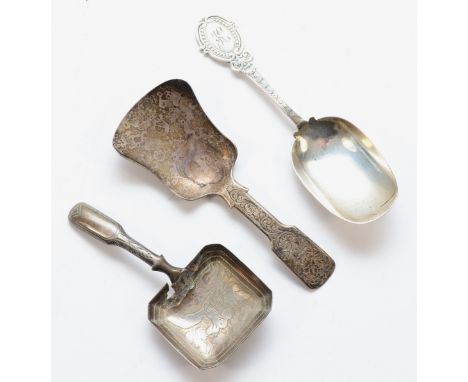 A Victorian silver shovel caddy spoon, Birmingham 1839, floral engraved handle, another Birmingham 1795 A/F and a third Birmi