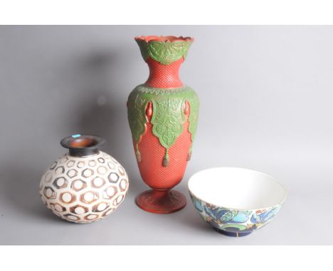 A large early 20th century red and green ceramic vase, 53cm, together with a large pottery bowl, and a cream and black squat 