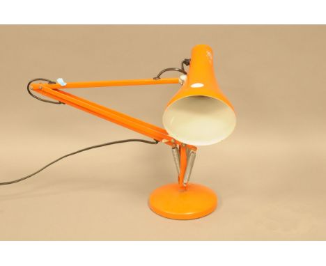 A vintage orange angle poise lamp from the Angle Poise Lamp co.  