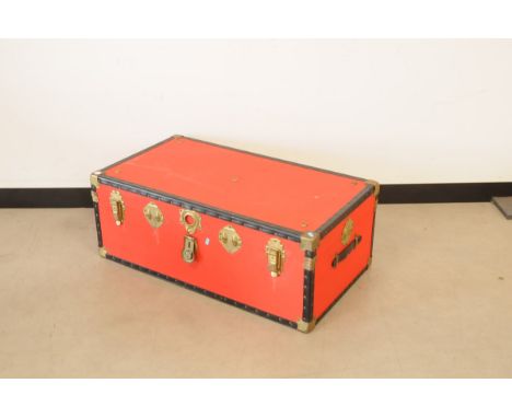 A mid 20th century travel trunk, in red, 92cm wide 