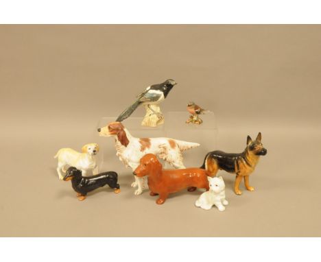 Six pottery and porcelain figures of dogs and two Beswick birds, including a Goebel Alsatian, Setter, Labrador and Dachshund,