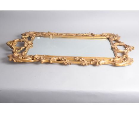 A first half 20th century Rococo style gilt framed mirror, 103cm high 
