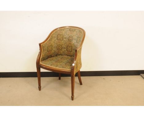 A first half 20th century mahogany and upholstered tub chair  
