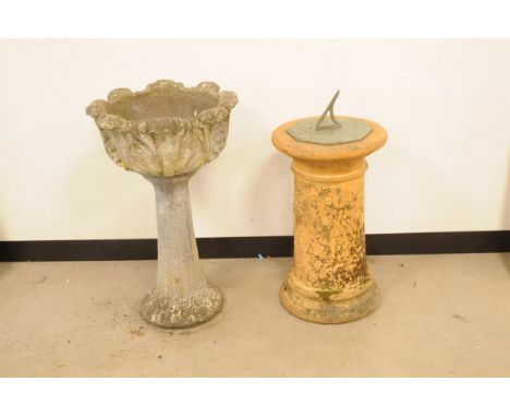 A c1970s concrete garden planter on stand and a terracotta pillar, the bowl with leaf outer on tapering support, 76cm high, t