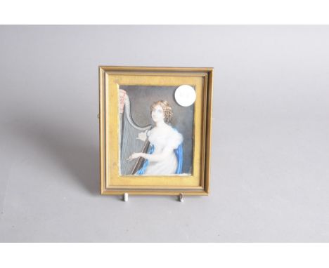 A late Georgian period portrait miniature of a lady, sat playing the harp, 11cm by 9cm, in a gilt frame 