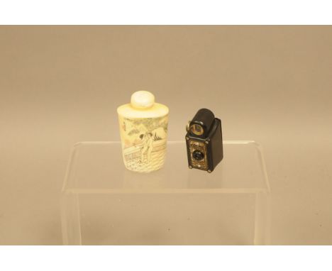 A vintage Coronet Midget black camera, togther with a second half 20th century Japanese erotic snuff bottle style bone item 