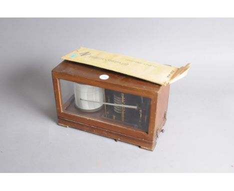 A first half 20th century barograph, in wooden case, with spare recorder charts 