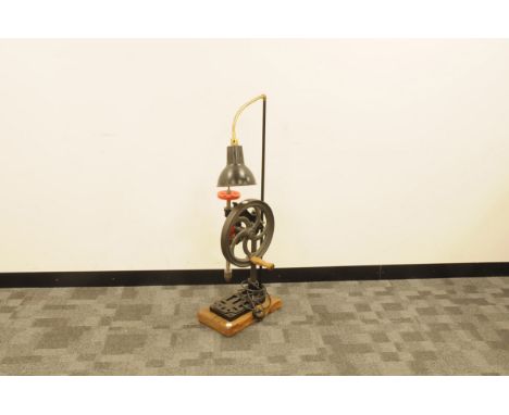 A vintage cast iron pillar drill now converted to a lamp, 105cm, on wooden base and appears to still function 