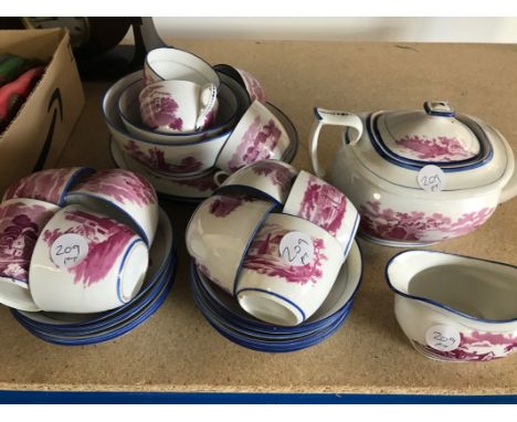 A Victorian Staffordshire porcelain tea set, similar to New Hall, with blue rims and purple transfer pint vingnettes, teapot 