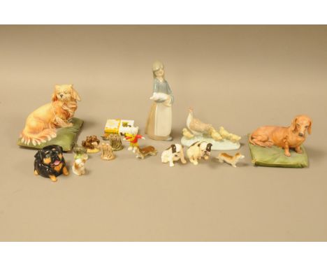 A group of collectable ceramics, including a Lladro figure of a girl holding a piglet, 17cm, a Nao chicken and chick group, t