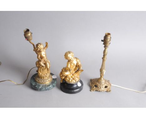 An early 20th century gilt metal and marble cherub on column lamp base, AF, 30cm, together with a brass lamp base and a gilt 