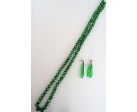 A single row necklace of graduated spherical jade beads, gross weight 75 gms and a pair of jade and seed pearl pendant earrin