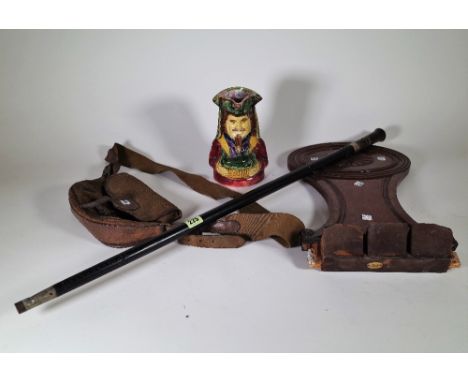 A late 19th century Indian sword stick, a Regency mahogany hall chair back, a cartridge bag and a Toby jug, (4). 