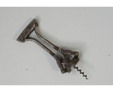 A Goliath type corkscrew marked 'GEHA', Patentamt Gesch Patented - Brevete, steel body, traces of nickel, wire helix.