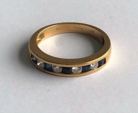 An 18ct gold, sapphire and diamond half-hoop ring, channel set with alternating circular cut diamonds and calibre cut sapphir