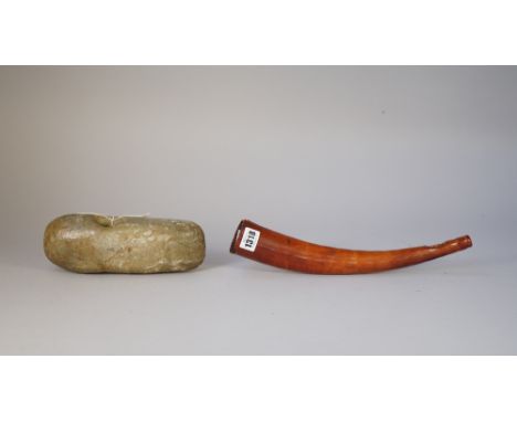 Tribal interest; a 19th century ivory Oliphant horn (34cm) and a green coloured hardstone axe/club head (23cm wide). (2) 