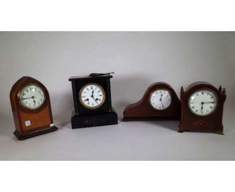 A group of three French clocks, including a mahogany lancet shaped mantel clock, a Belgium slate mantel clock and a mahogany 