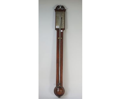 A Victorian mahogany stick barometer, by Smith Reading, with broken arch pediment, silvered rectangular plate, clear glass tu