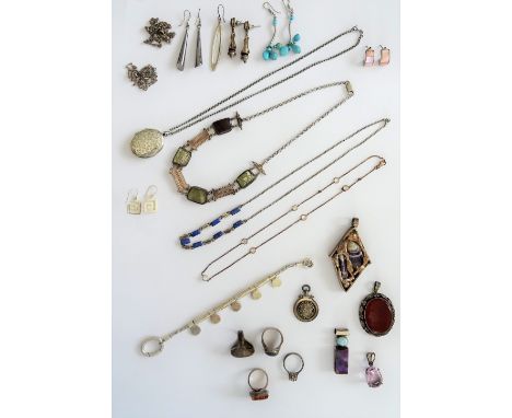 A group of mostly silver mounted jewellery, comprising; a moss agate ring, three further gem set rings, an oval cornelian pen