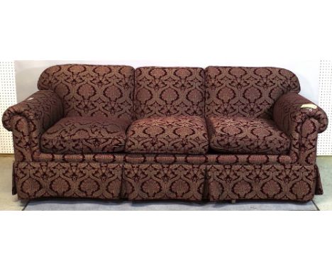 'Louis Mittman Inc', a 20th century three seater sofa with rollover arms on tapering square supports, 219cm wide. 