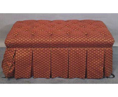 A 20th century rectangular overstuffed footstool with button back upholstery, 111cm wide x 39cm high. 