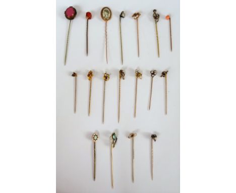 A gold topped and seed pearl stick pin, with a trefoil motif, a gold topped and seed pearl stick pin, with a ropetwist knot m