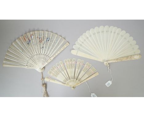 A continental ivory fan, 19th century, with plain sticks and an ornately carved foliate stick guard and central monogram, 21.