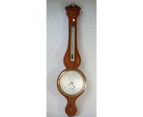 An Edwardian mahogany and shell inlaid wheel barometer by Minola, Holborn, London, with broken arch pediment and thermometer,