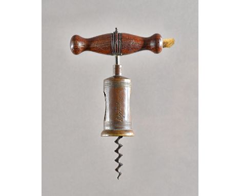 A 19th century corkscrew with turned rosewood handle and brush, wide brass barrel detailed 'Apollinarious' and wire helix. Il