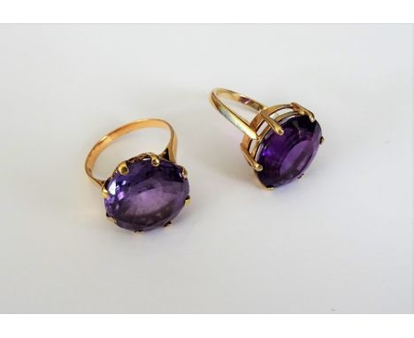 A 9ct gold ring, claw set with an oval cut amethyst, ring size L and a half and an Egyptian gold ring, claw set with a circul