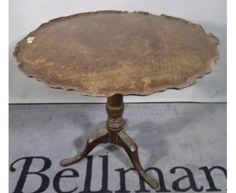 A George III mahogany tripod table, the pie crust top on three carved downswept supports, 80cm wide x 69cm high. 