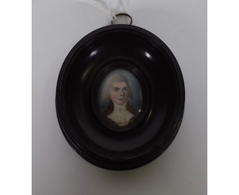 Late 18th century English School, a portrait miniature on ivory of Dr McCann, in an oval wooden frame, image 3.5cm high (a/f)