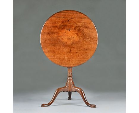 A mid-18th century mahogany tripod occasional table, the circular snap top on bird cage mount and baluster turned column, 60c