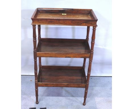 A Charles X rosewood three-tier étagère with rectangular tray top on ring-turned supports, 42cms wide, 71.5cms high. 