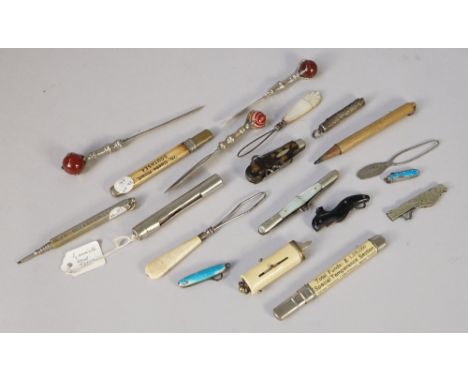 An Edwardian miniature 'shoe' form button hook (4.8cm), three small utility knives, three ball and claw set letter openers an