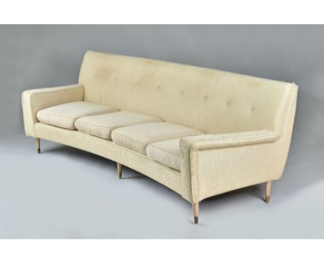 In the manner of Gio Ponti; a mid-20th century cream upholstered curved sofa, on turned tapering beech supports,  220cm wide 