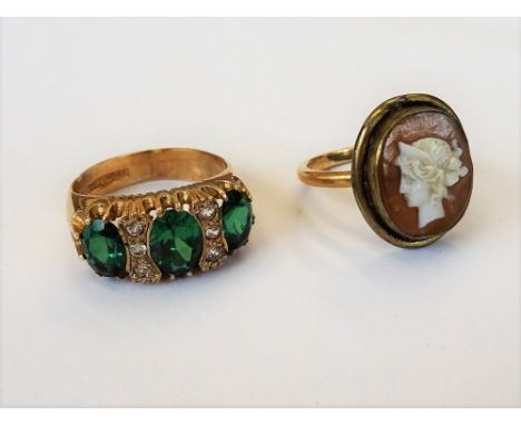 A 9ct gold, green and colourless gem set ring, Birmingham 1972, ring size O and a half, gross weight 5.2 gms.and a gold and g