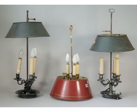 A 20th century French gilt brass Bouillotte lamp with red tole shade, the base in the form of three dolphins, adapted 55.9cm 