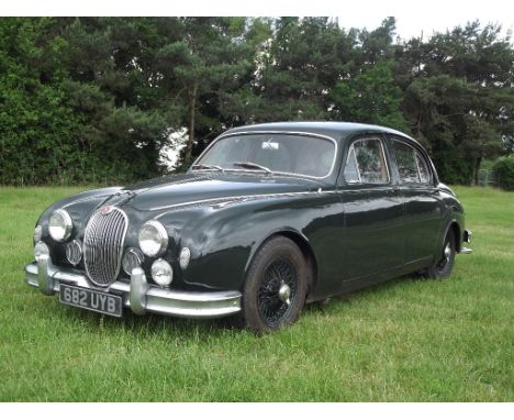 A 1957 Jaguar 3.4 Mk I automatic saloon, registration number 682 UYB, British Racing green. William Lyons' new compact Jaguar